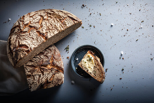 Slice of brown rye bread on table