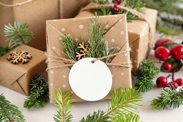 Christmas present with round blank gift tag close up, Mockup