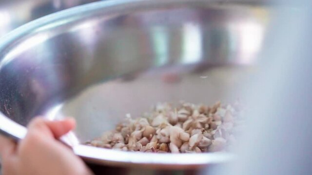  Shaking garlic enameled bowl slow motion 100fps