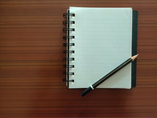 A Notebook with pencil