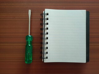 Screwdriver and a notebook