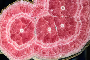Rhodochrosite is a manganese carbonate mineral. In its rare pure form, it is typically a rose-red...