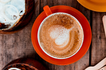 Delicious cup of coffee with latte art in middle
