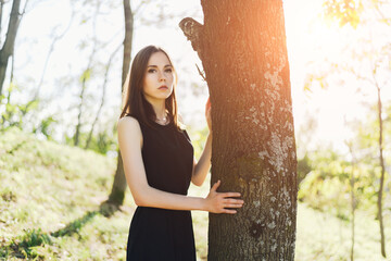 Portrait of beautiful young woman in the park.