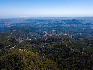 Fototapeta na wymiar Aerial view from drone of forested rocky hills landscape