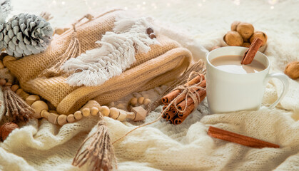 scandinavian style cozy morning with some knitted blankets, cacao mug, gift box, winter and festive mood, cristmas vibe.