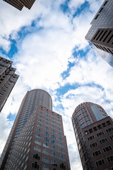Fototapeta na wymiar Abstract architectural landscape of tall round buildings on cloudy blue sky in downtown Boston, Massachusetts