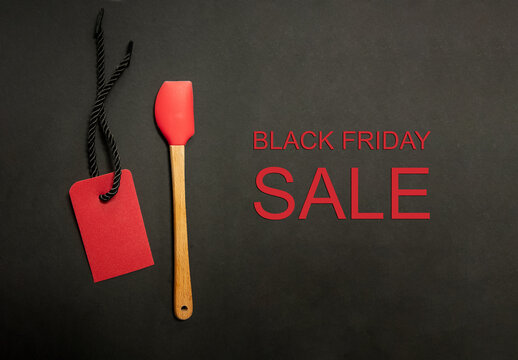 Spatula and price tag on black background. Black Friday Sale or Discount banner for bakery or kitchenware shop. Modern minimal design with space for text. Template for promotion, advertising, web