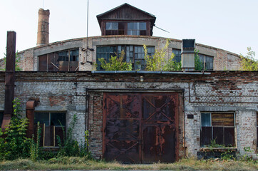 Front view of old abandoned factory building
