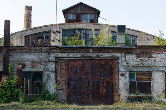 Front view of old abandoned factory building

