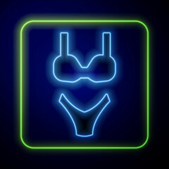 Glowing neon Summer beach swimsuit icon isolated on blue background. Beach women fashion. Vector