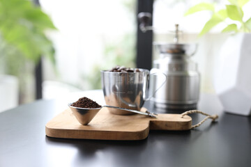 coffee scoop and stainless grinder pot