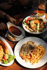 typical German food, sausages, on a wooden table in a bar