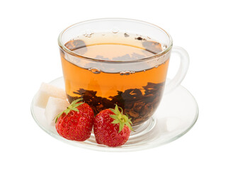 light ceylon tea in a cup with strawberries and sugar lumps. natural color
