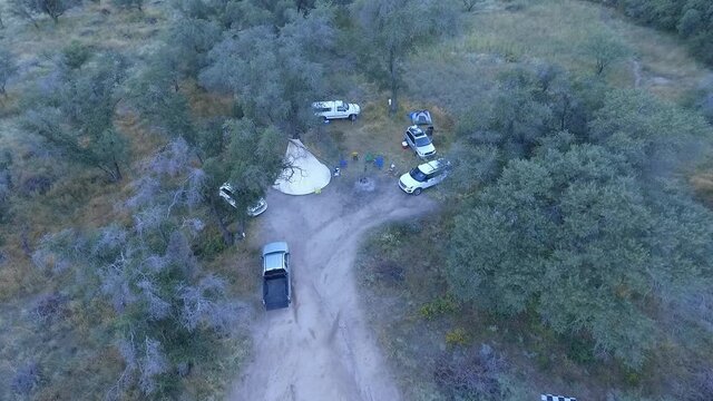 Aerial orbit of a teepee, or tipi at a modern campsite