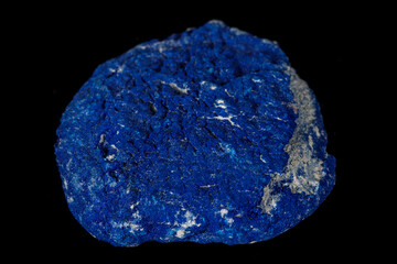 Macro mineral stone Azurite in siltstone against black background