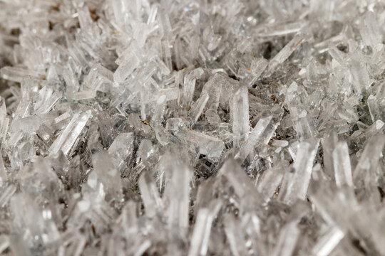 Macro mineral stone sulfite quartz on a black background