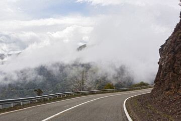 Mountain road and dangerous fog