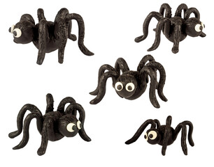 Obraz premium Set of funny black spiders made of plasticine. Isolated on a white background.