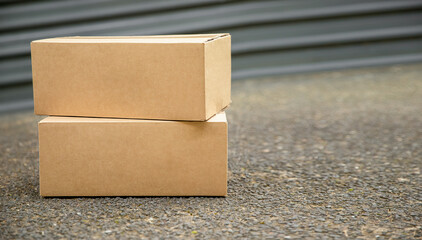 cardboard boxes delivered to the forn door and left outside for contactless pickup, delivery for...