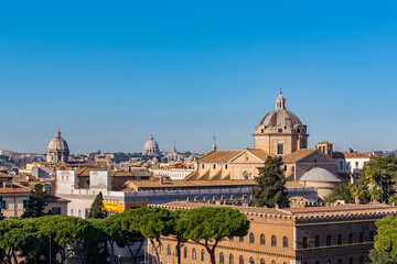 Fototapeta na wymiar A view of Rome as seen from the Altare della Patria (Altar of the Fatherland) with Building of Insurance Company and Jesus church in background