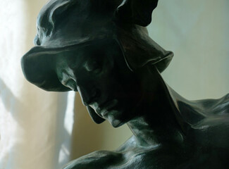 Head of statue of Eros close up. - obrazy, fototapety, plakaty
