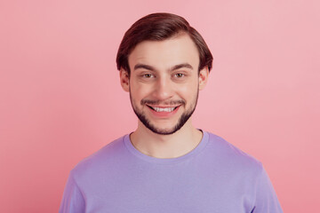 Portrait of satisfied attractive young man happy positive smile wear casual outfit isolated over pink color background