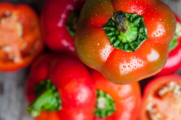 Fresh raw sweet red pepper on old wooden background. Pepper ratunda (gogoshar). Food background....