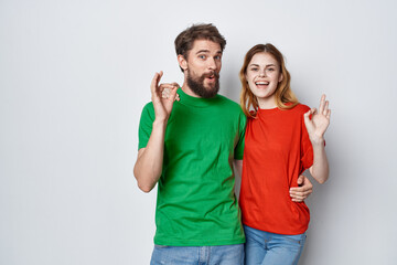 man and woman multicolored t-shirts communication quarrel isolated background