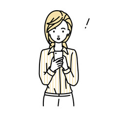 立ってスマートフォンを操作して何かに気づいて驚いたブラウスの女性