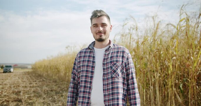 Senior Farmer, Portrait Caucasian Man in Plaid Shirt in the wheat field, sorghum