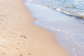 Soft wave of the sea on the sandy beach.Soft focus,blurred image.