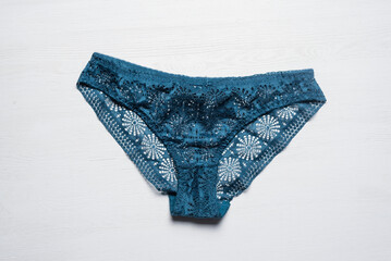 Female panties on the white flat lay background.