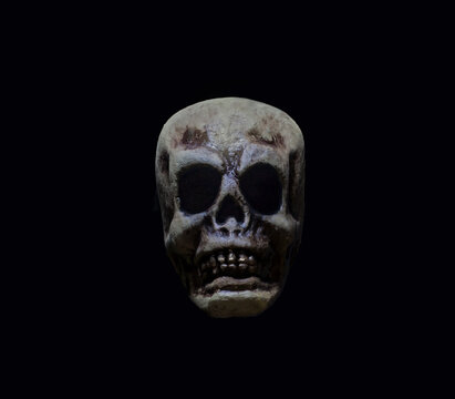 Scary skull isolated in the dark.  skull on black background 