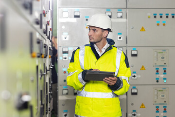 Technician inspect to control panel screen system for generate electricity of factory in...