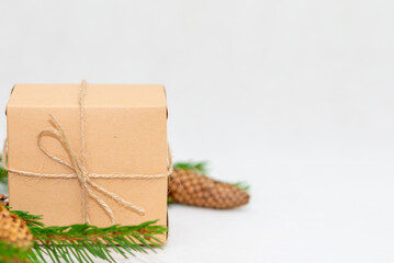 Holiday card. Beige gift box on white background. Flat lay,copy space.