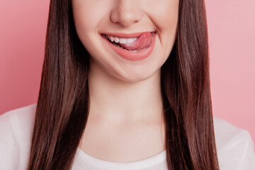 Cropped close-up view portrait of nice attractive lovely cheerful woman lick lips tongue yummy isolated over pink color background - obrazy, fototapety, plakaty