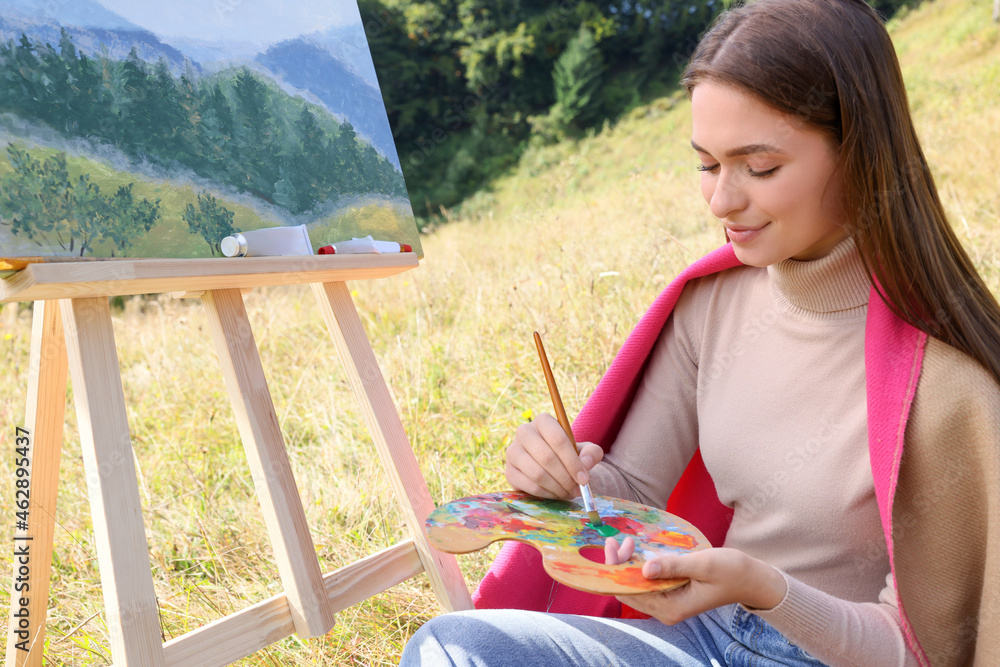 Sticker young woman drawing on easel with brush outdoors