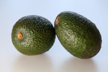 Avocados on a table.