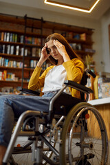 Fototapeta na wymiar Stressed female student in wheelchair, disability