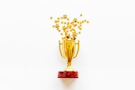 Championship award golden trophy cup with shiny stars