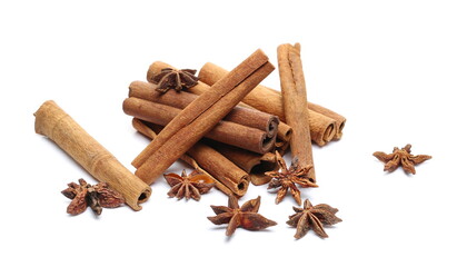 Cinnamon sticks and star anise pile isolated on white 