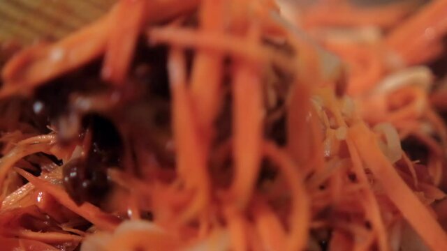 Delicious yam, carrots, tomato, and onion slices in cooking pot