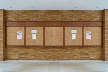 bulletin board with brick background