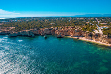 Obraz na płótnie Canvas Flying over the sea cliff at Ponta Da Piedade in Algarve, Portugal 