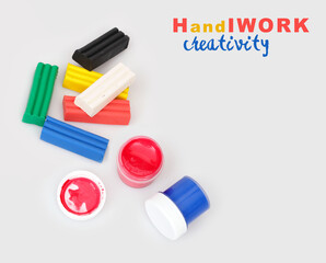 Bottles with multicolored gouache isolated on white background