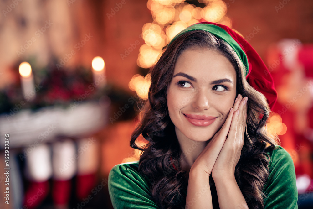 Wall mural photo of nice young brunette lady hold hands look wear green costume at home on holiday