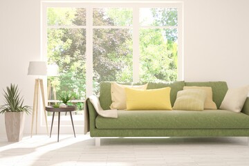 White stylish minimalist room with sofa and summer landscape in window. Scandinavian interior design. 3D illustration