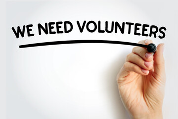 WE NEED VOLUNTEERS underlined text with marker, concept background