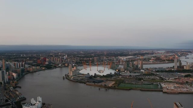 Aerial view of Millennium Dome on Greenwich Peninsula. The O2 entertaining district on Thames riverbank in sunset time. London, UK